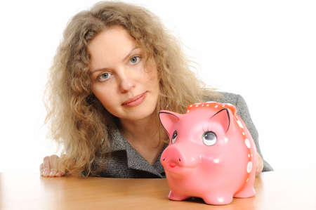    Business woman with a piggy bank の写真素材