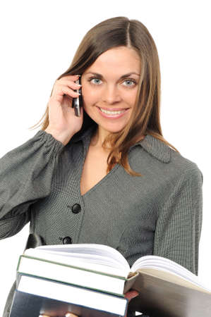  The young woman with the book and phoneの写真素材
