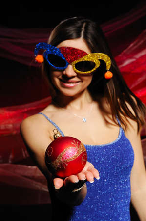  The girl in a mask, holds a toy in handsの写真素材