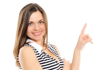 Happy young woman pointing at copy spaceの写真素材