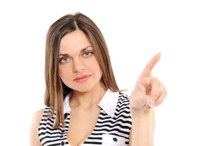  young woman showing on something by a fingerの写真素材