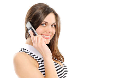  beautiful business woman speaks by phone, on a white backgroundの写真素材