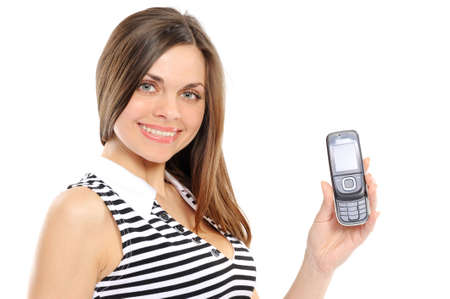 Portrait of a happy woman showing her new phone on white backgroundの写真素材