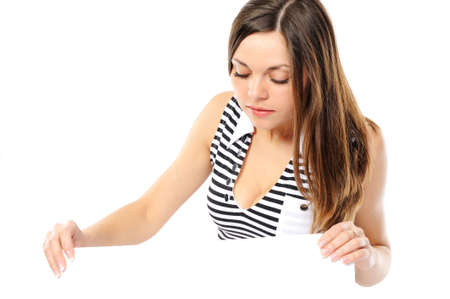 Beautiful girl holding empty white board on a white backgroundの写真素材