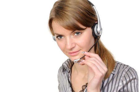 Young female customer service representative in headset on a white backgroundの写真素材