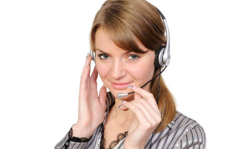 beautiful young woman in headphones smiles in current of telephone conversation on a white backgroundの写真素材