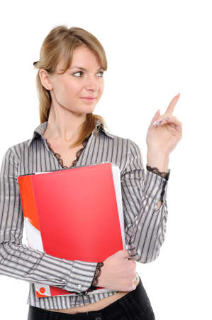   Young woman in business attire holding folder, showing on something by a finger - isolated on a white backgroundの写真素材