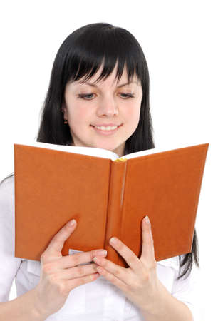 Portrait of the young woman reading the book on a white backgroundの写真素材