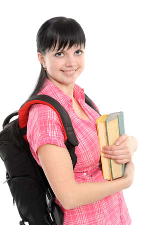Young woman with book and backpack; isolated on a white backgroundの写真素材