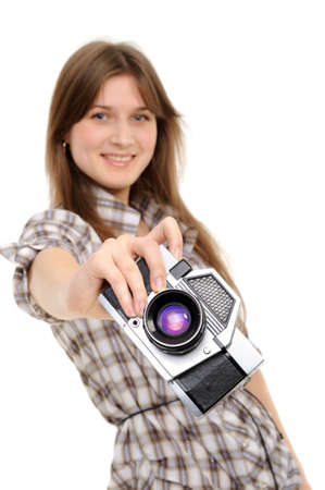 Pretty woman taking photo with vintage cameraの写真素材