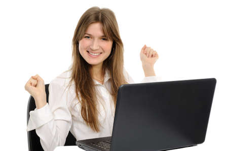 Excited woman with laptop  enjoying success on white background の写真素材