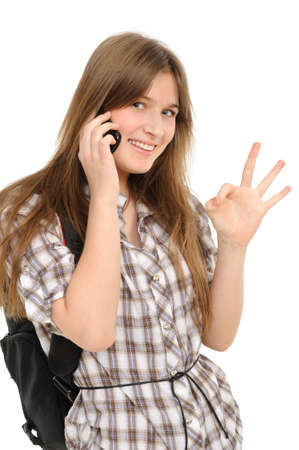 young woman with phone indicating ok sign  on a white backgroundの写真素材
