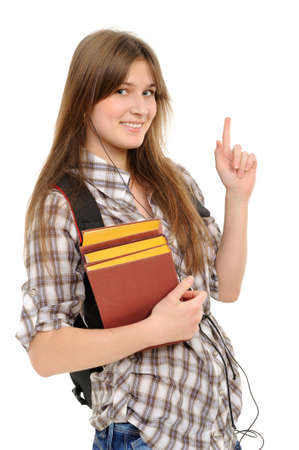 Young woman showing on something by a finger - isolated on a white backgroundの写真素材