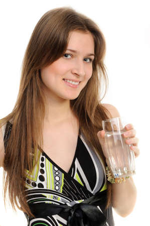Young woman with glass of water isolated against white backgroundの写真素材