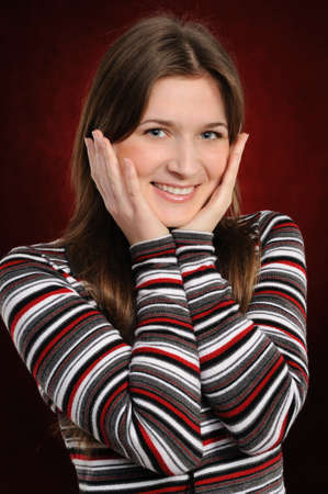  Portrait of the attractive woman on a red backgroundの写真素材