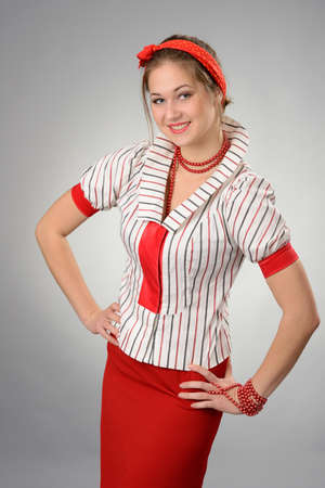 portrait of happy young woman with a red bandage on a headの写真素材