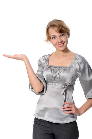 Beautiful business woman holding hand presenting a product. On a white background の写真素材
