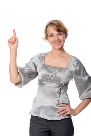 woman showing on something by a finger - isolated on a white background の写真素材