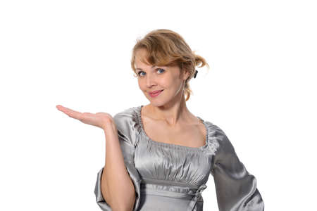 Beautiful business woman holding hand presenting a product  On a white background の写真素材
