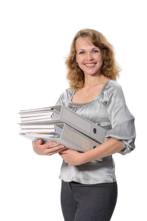 Beautiful confident woman with a Ð½eavy folders on a white background の写真素材