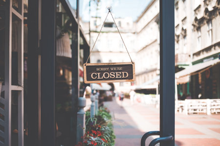 sign we are closed on the door of the restaurant