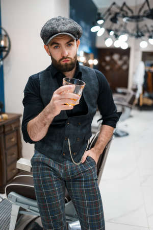 Barber master with a glass of whiskeyの写真素材