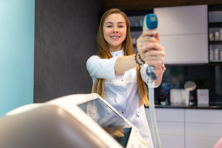 Female cosmetologist with a laser for hair removal