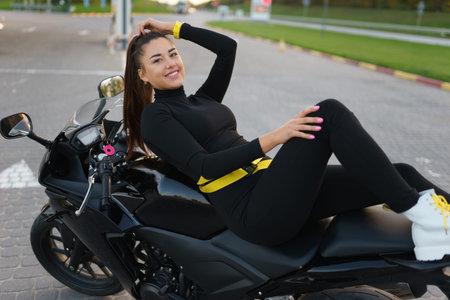 Stylish biker girl on motorcycle