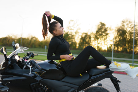 Stylish biker girl on motorcycle
