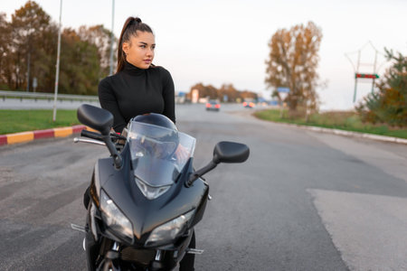 Stylish biker girl on motorcycle