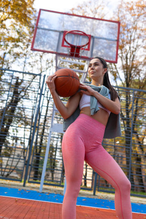 Athlete girl with a basket ball. Basketball player portrait