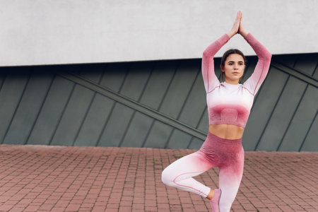 Sports woman standing in yoga pose
