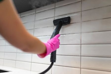 Cleaning tiles with steam machineの写真素材