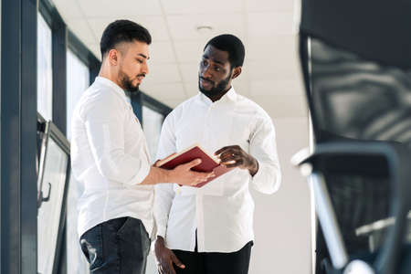 Business partners in office discussing company affairsの写真素材