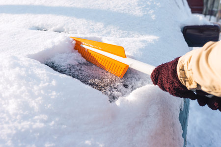 Cleaning snow from a car body