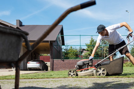 Opening a fuel tank to refill a fuel tank in a petrol lawn mowe