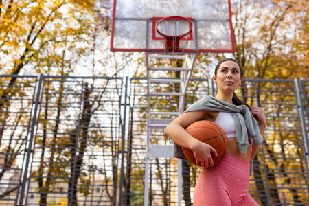 Athlete girl with a basket ball. Basketball player portrait