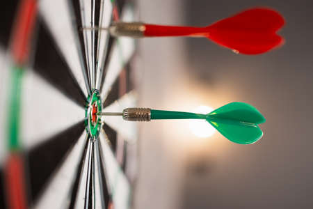 Close up view of dartboard with dartsの写真素材