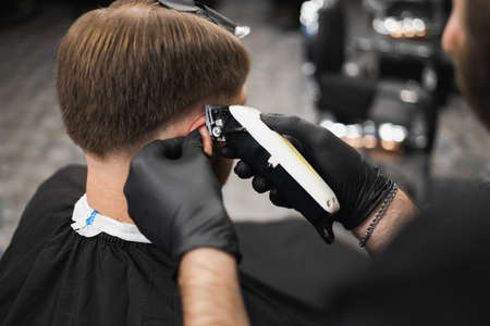 Haircut and styling barbershop. man in barbershopの写真素材