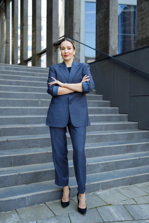 Beautiful business woman on the background of a modern buildingの写真素材