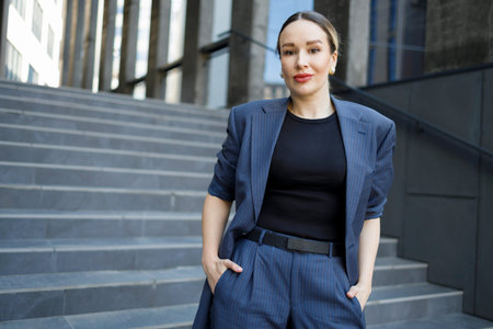 Portrait of stylish woman posing with hands in pocket