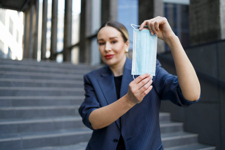business woman showing medical maskの写真素材