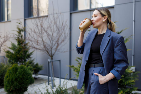 Business woman drinking coffee during a work break