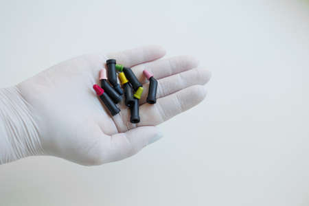 Tubes with teeth composite filling materials in dentist handsの写真素材