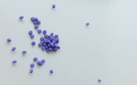 Scattered blue pills on a white background. Dental plaque detection toolの写真素材