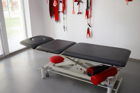 Physiotherapist's office with suspension therapy system red cord for treatment and rehabilitationの写真素材