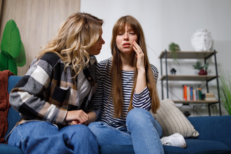 Mature woman supports her depressed daughter in a difficult moment after breaking up with her boyfriend. You will still find your true loveの写真素材