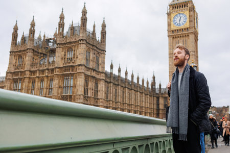 Stylish male tourist on the background of London Big Benの写真素材