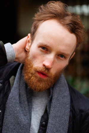 Close-up portrait of a bearded man outdoors
