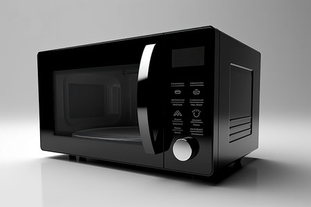 Sleek Black Microwave on White Backgroundの素材